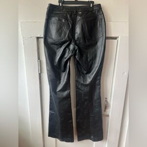 Newport News jeanology Black leather pants with a relaxed fit.